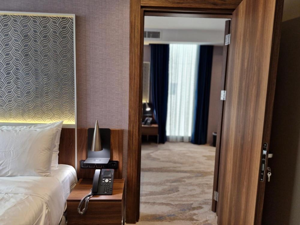 Ocean View Hotel Kuwait suite with partial bedroom and living area view