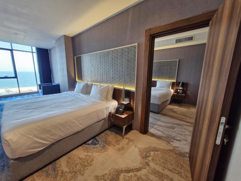 Ocean View Hotel Kuwait suite with partitioned sleeping and lounge areas