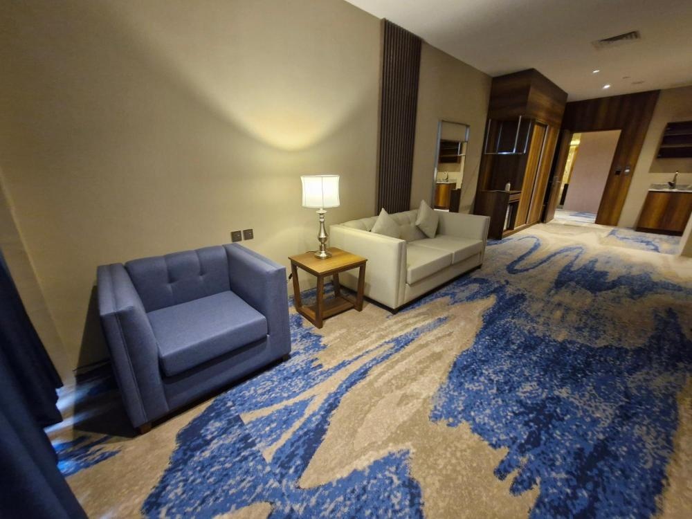 Hotel in Kuwait lounge area with sofas and blue carpet design