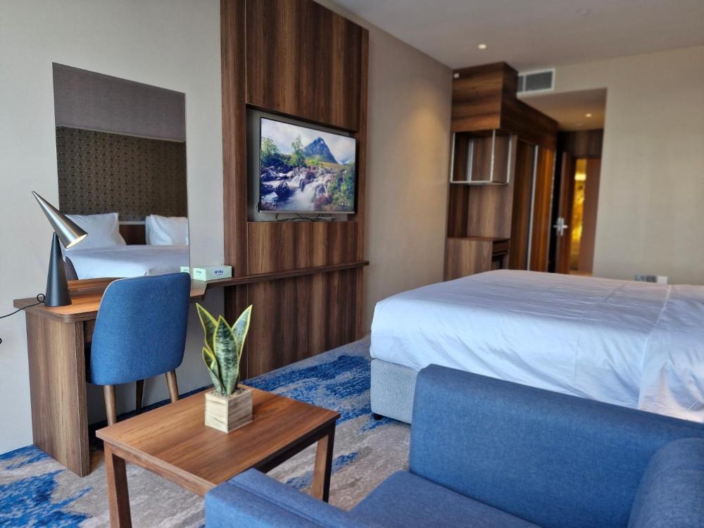 Hotel in Kuwait room with workspace sofa and modern decor