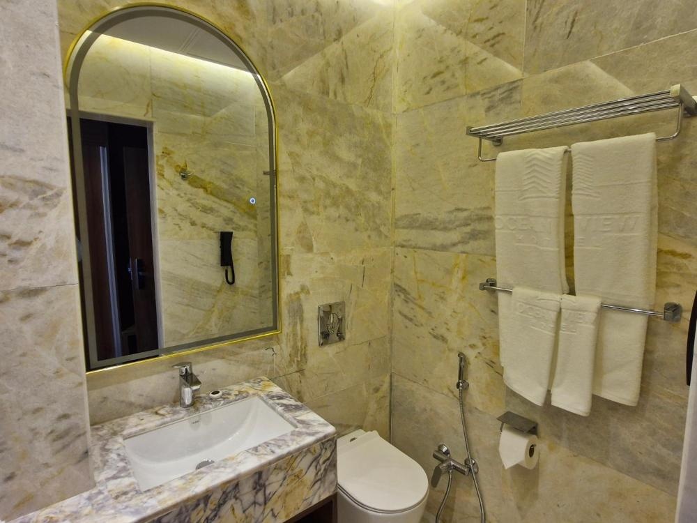 Bathroom at Hotel in Kuwait with marble finish and towel rack