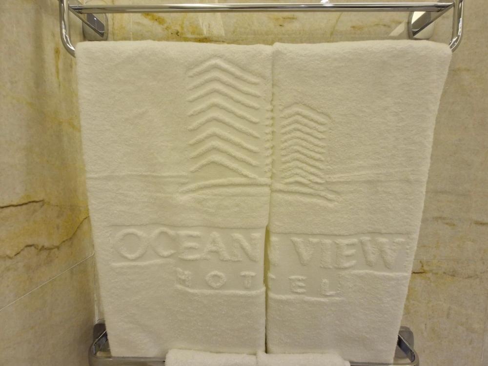 Embroidered towels at Ocean View Hotel Kuwait bathroom